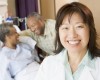 Nurse Smiling In Hospital Room